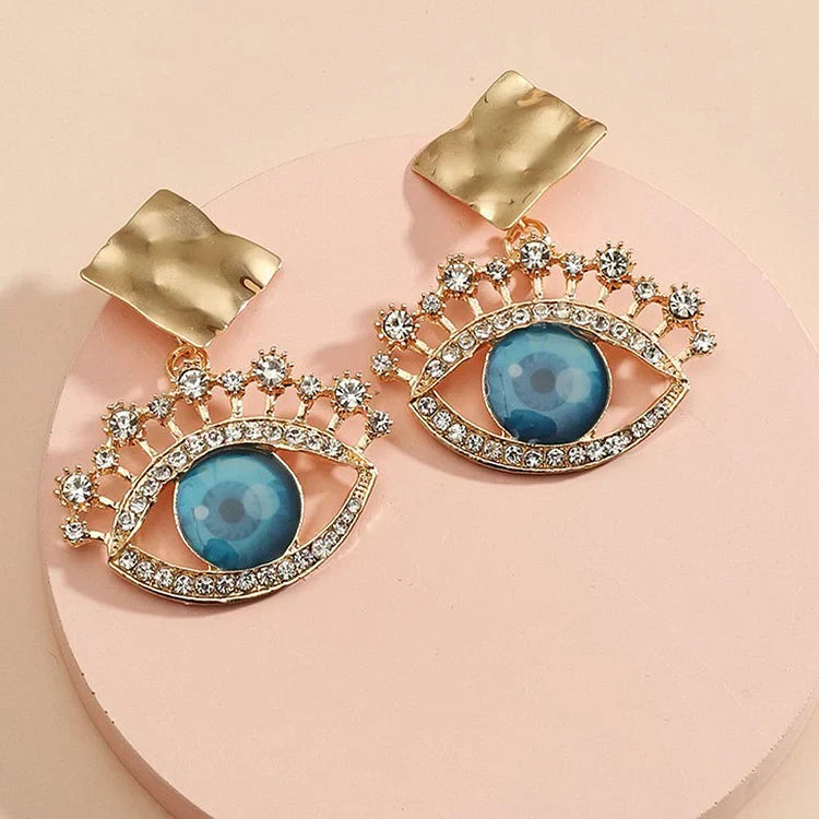 Nerina - Boucles d'oreilles vintage dorées mauvais œil