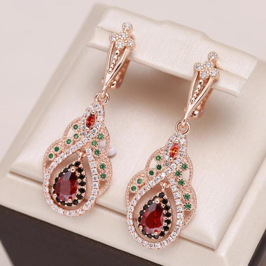 Kylie - Boucles d'oreilles mandala doré en zircone rouge