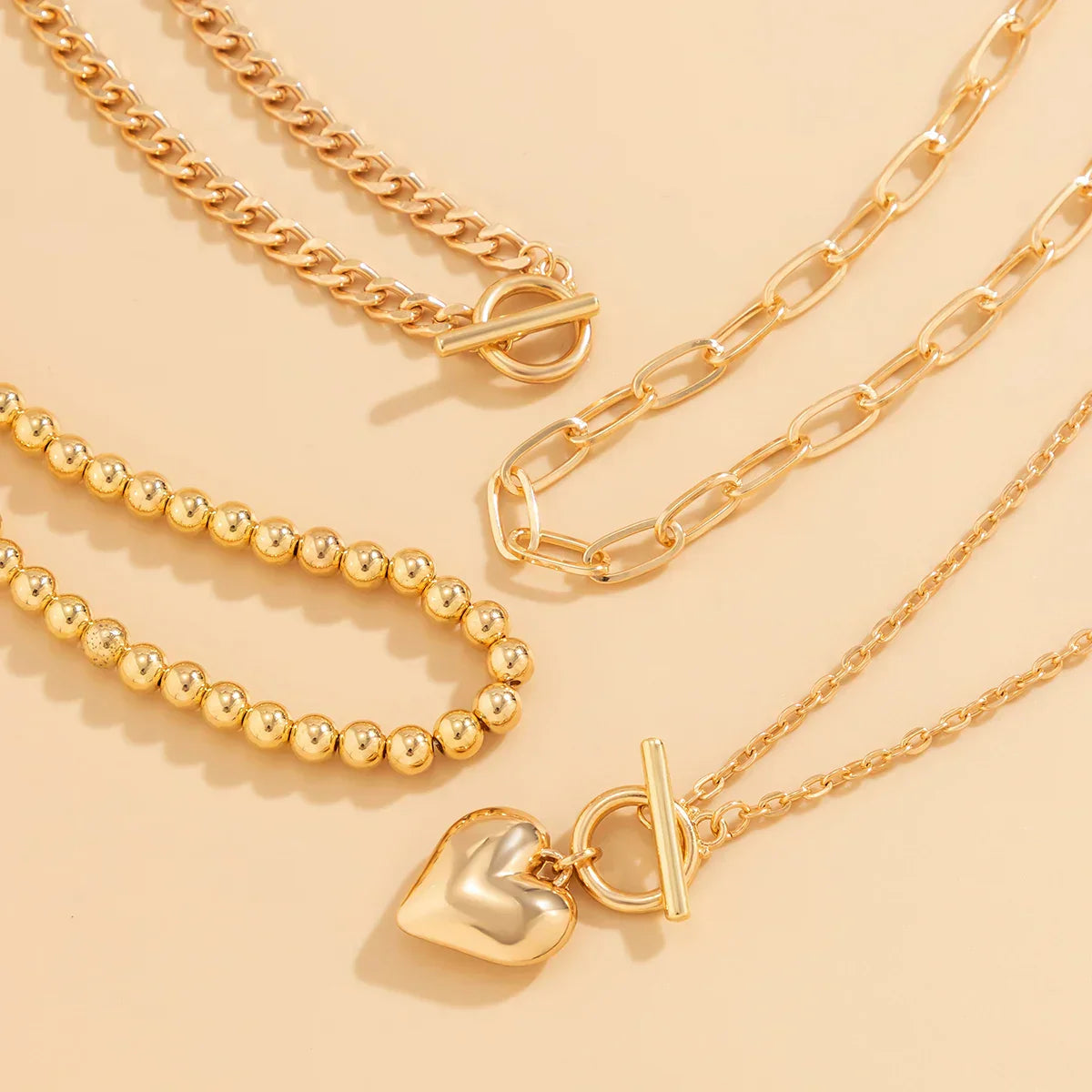 HeartGleam - Set de colliers pendentifs cœurs dorés élégants